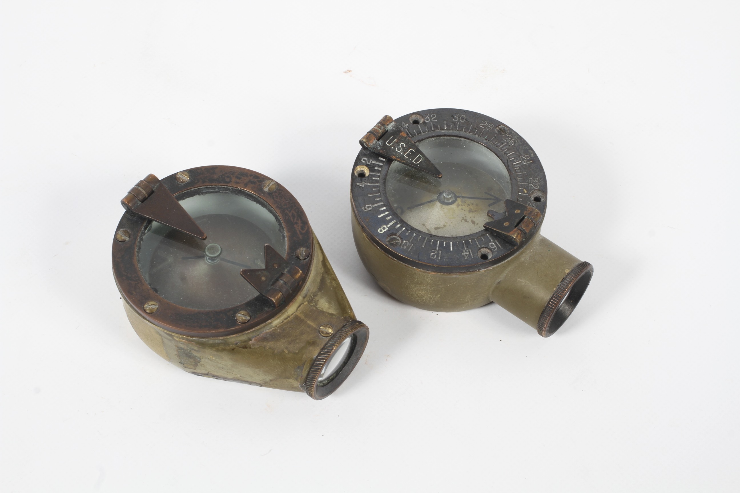Two WWI period Creach-Osbourne handheld marching compasses. Made by the Sperry Gyroscope Co.