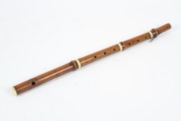 An early 19th century boxwood and ivory mounted one keyed flute.