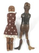 Two 19th century and later carved wooden 'Jigglers' dancing figures.