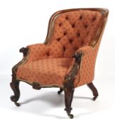 A Victorian mahogany framed spoon button back elbow chair.