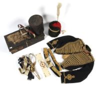A Hawkes & Co Royal Horse Artillery jacket, a busby with plume in tin, a sword belt,