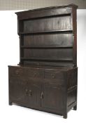 An early 19th century stained kitchen dresser.