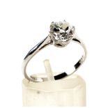 A platinum set brilliant cut solitaire diamond ring. Mounted in a six claw setting approx 0.
