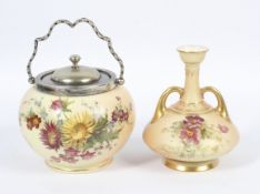 A late 19th century Royal Worcester blush ivory ground vase and a silver-plated biscuit barrel.