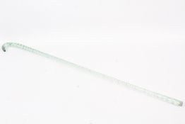A Victorian glass rope twist walking cane in green tint.