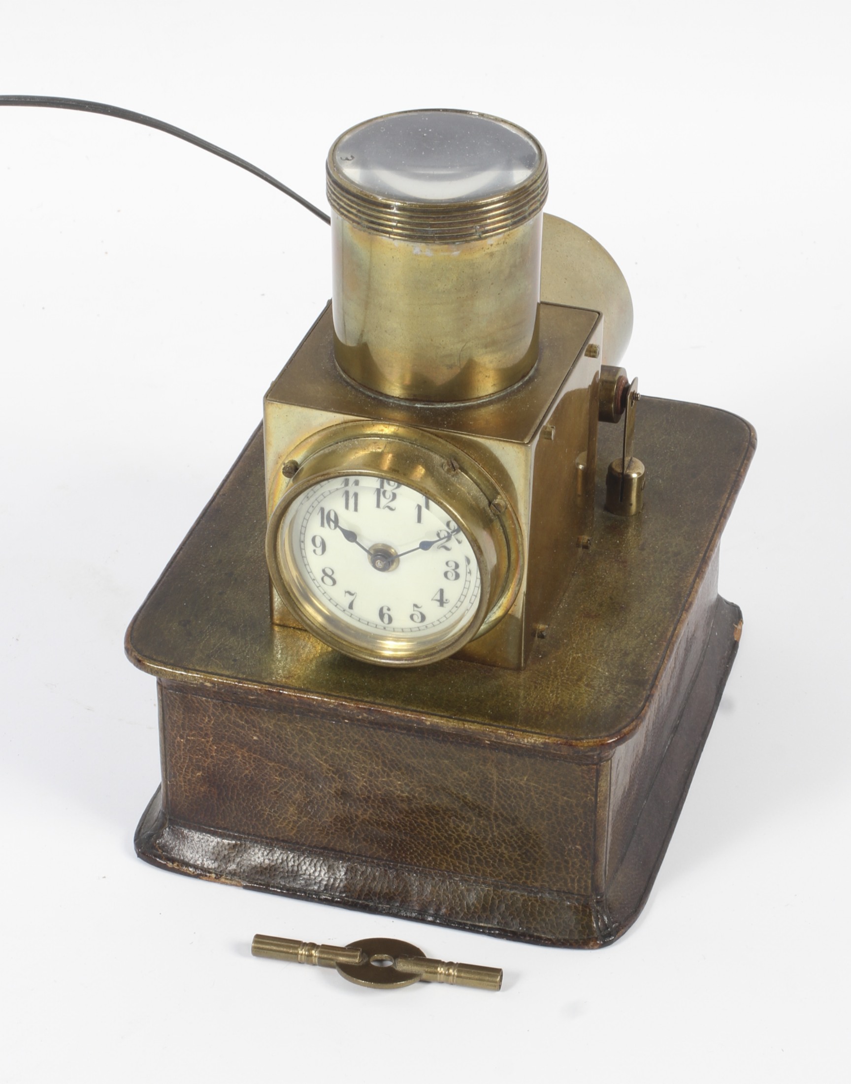 A vintage brass night projecting bedroom clock, circa 1910.