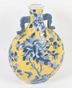 A 20th century Chinese twin-handled moon flask.