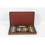 A mid-century opticians trial set of lenses in original box.