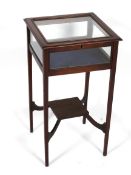 An Edwardian inlaid mahogany Bijouterie table.