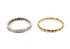 Yellow metal rope twist ring 1.1 grams, size N and white metal and diamond ring 2.2 grams, size K.