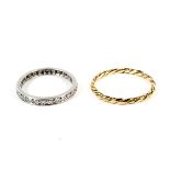 Yellow metal rope twist ring 1.1 grams, size N and white metal and diamond ring 2.2 grams, size K.