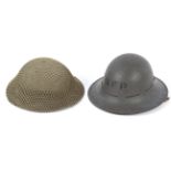 Two mid-century military helmets. One being marked and dated BMB 1941.