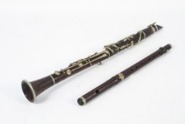 A late 19th/early 20th century rosewood clarinet retailed by A Chappell and a wooden fife,