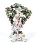 A 19th century Continental porcelain Chelsea figure.