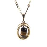 A Continental 9ct gold tigers eye pendant on a chain. The pendant hallmarked VA 375, weight 3.