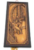 A 20th century Chinese fruitwood carved panel.
