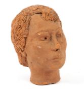 A 20th centurty terracotta studio pottery bust of a woman.