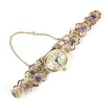 A 9ct gold oval faced sovereign ladies watch and strap.