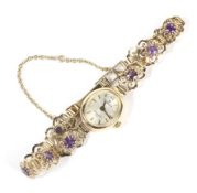 A 9ct gold oval faced sovereign ladies watch and strap.