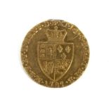 A George III 1787 shield back guinea.