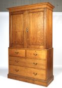 A late 19th/early 20th century oak linen press.