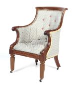 A 19th century Regency style upholstered library armchair.