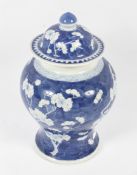 A 19th century Chinese blue and white bulbous jar and cover.