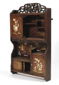 A late 19th century Japanese wall hanging cabinet.