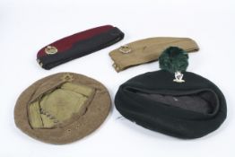 Four mid-century military hats and side caps.