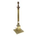 A Victorian brass candlestick modified into a lamp base.