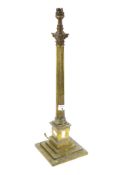 A Victorian brass candlestick modified into a lamp base.