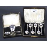 A boxed set of six teaspoons and egg cup and spoon set.