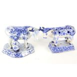 Two Delft ceramic models of cows.