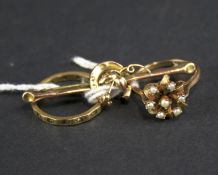 Two 9ct gold rings and a yellow metal brooch.