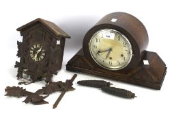 A 20th century oak cased mantel clock and a cuckoo clock.