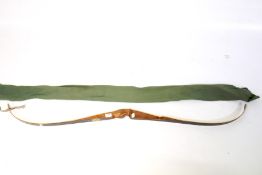 An 'Archery Marksman Products' wooden bow.