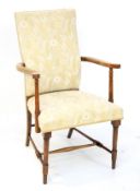 A 20th century mahogany armchair.