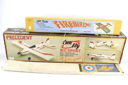 Three vintage kites and model planes.