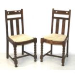 Two 20th century oak dining chairs.