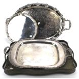 A collection of three large silver plated trays and another.