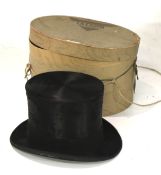 A 19th century black silk top hat. By by Lock & Co.