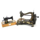 An early 20th century Jones's hand sewing machine and a smaller sewing machine.