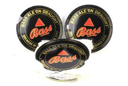 A collection of twenty vintage Bass ale metal beer trays.