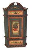 A 20th century painted corner cabinet.