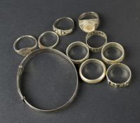 Nine silver and white metal rings and a silver bangle.