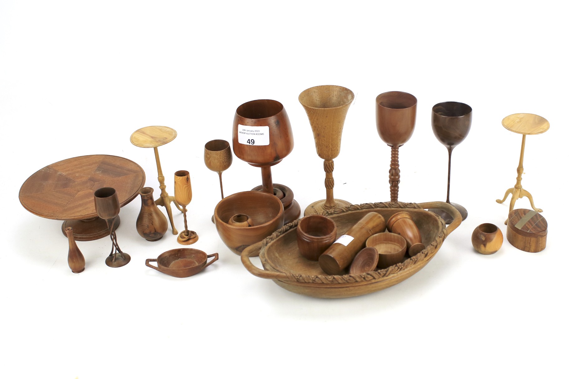 An assortment of wooden treen. To include goblets, tables, dishes, etc, largest 15.