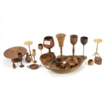 An assortment of wooden treen. To include goblets, tables, dishes, etc, largest 15.