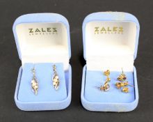 An assortment of 9ct gold and yellow metal earrings.