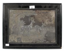 A Victorian silver plated picture depicting a pair of deer in a forest landscape. 24.