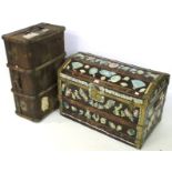 A wooden domed trunk and a wooden bound travelling trunk.